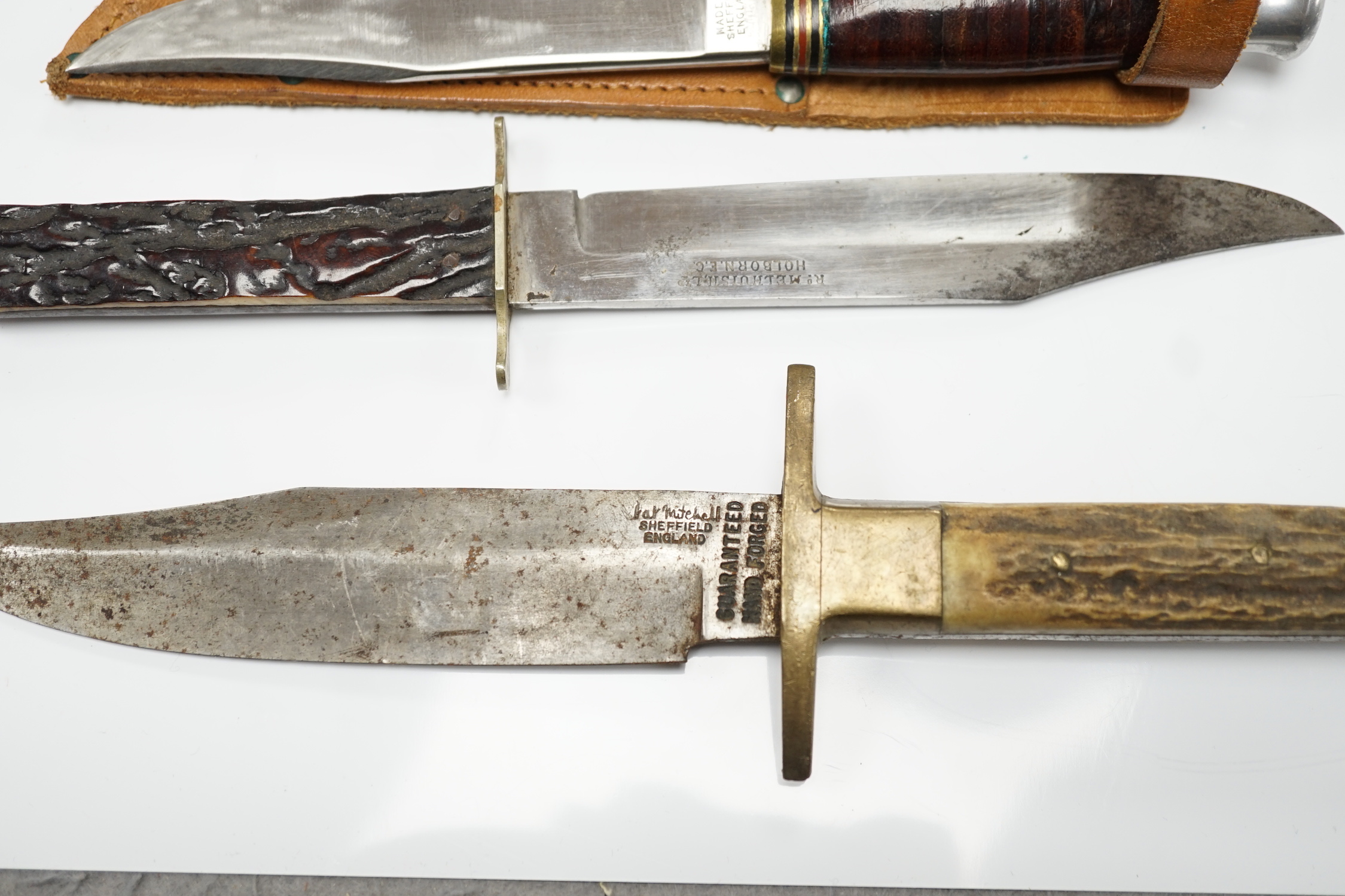 Two antler-handled hunting knives and three other knives
